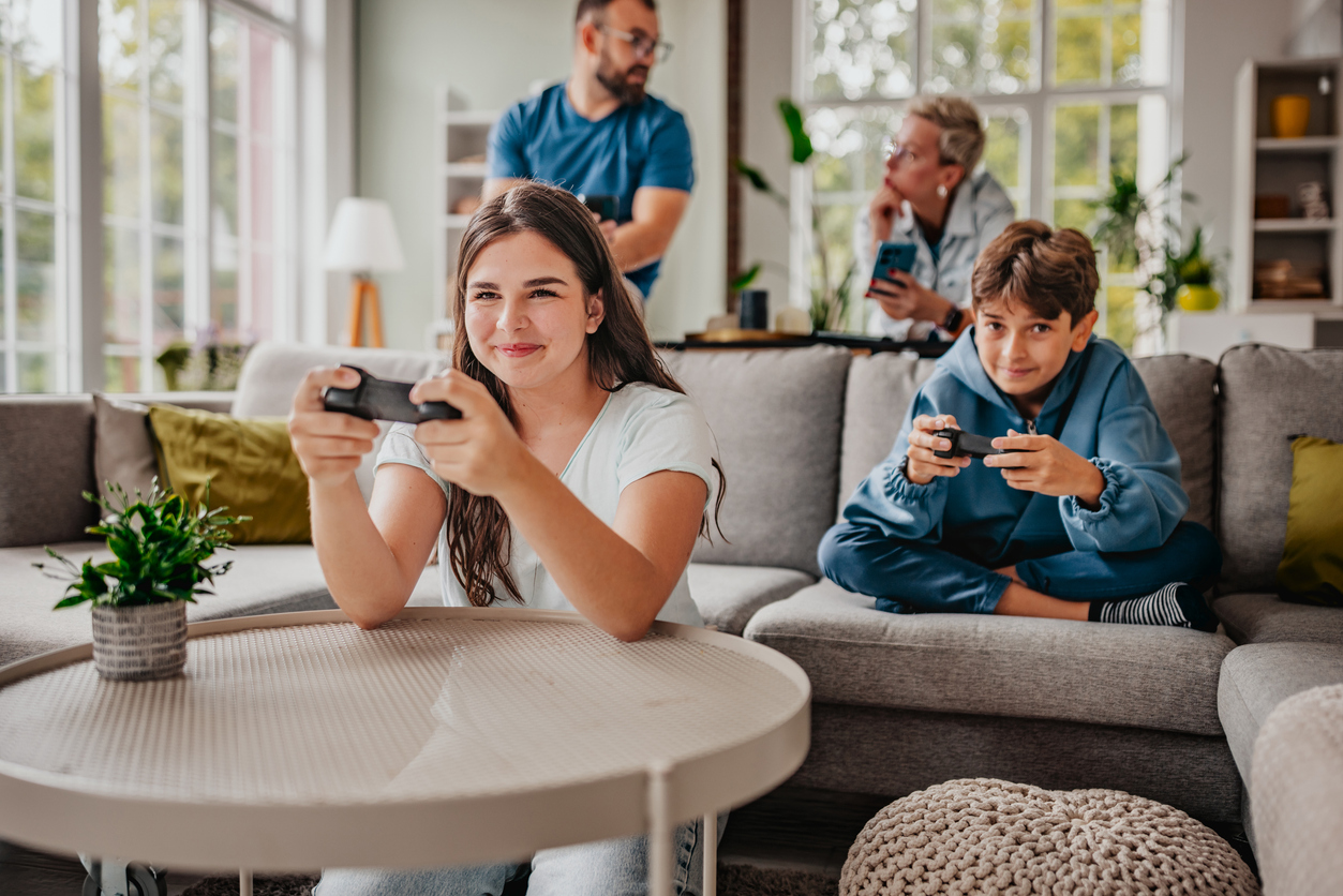 playing video games. The cozy atmosphere is filled with laughter and togetherness.