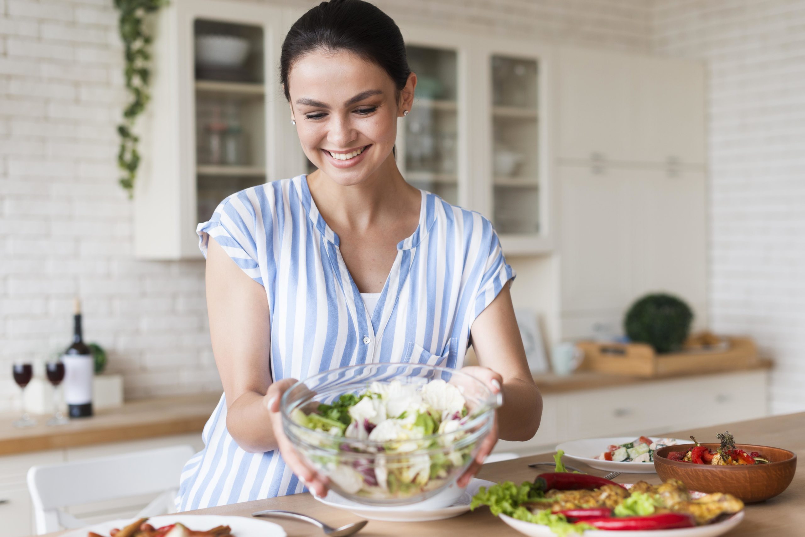 medium-shot-smiley-woman-holding-bowl-High-blood-pressure-scaled