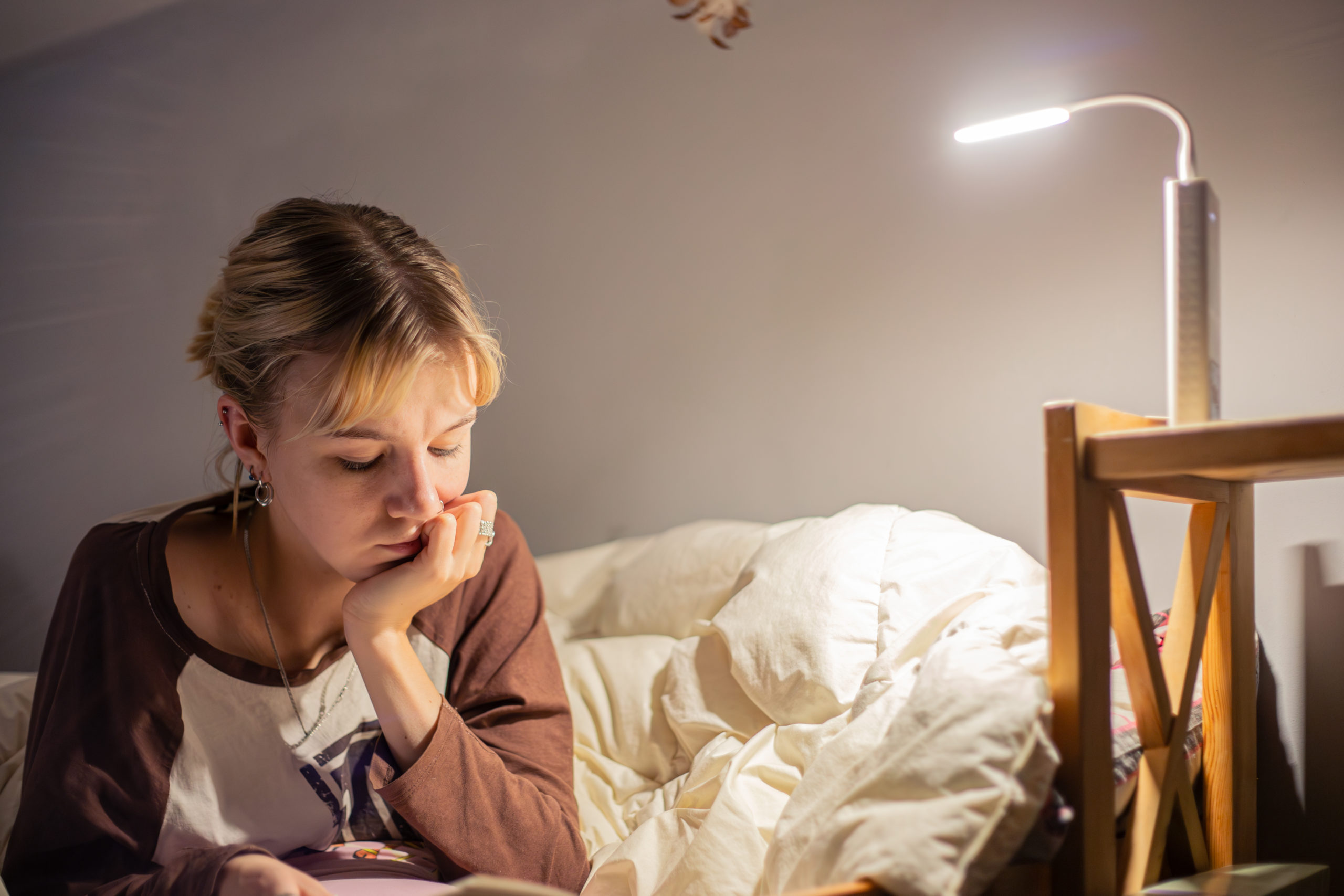 young-woman-reading-book-blackout-reading-book-dark-sleep-scaled
