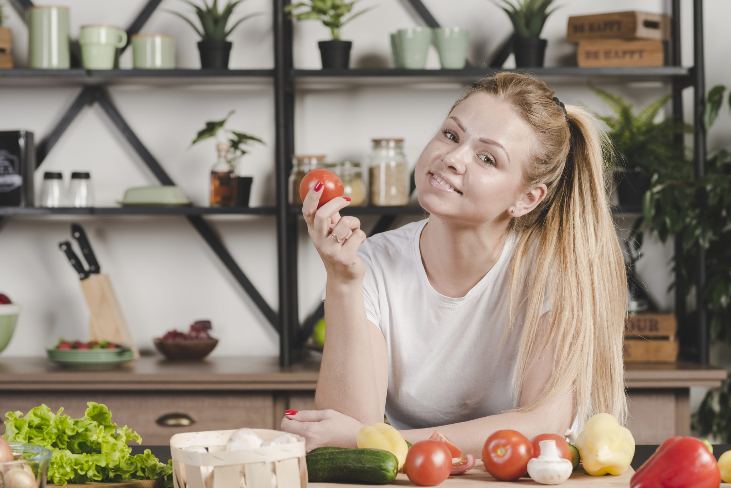 portrait-young-woman-holding-red-tomato-eye-health-scaled