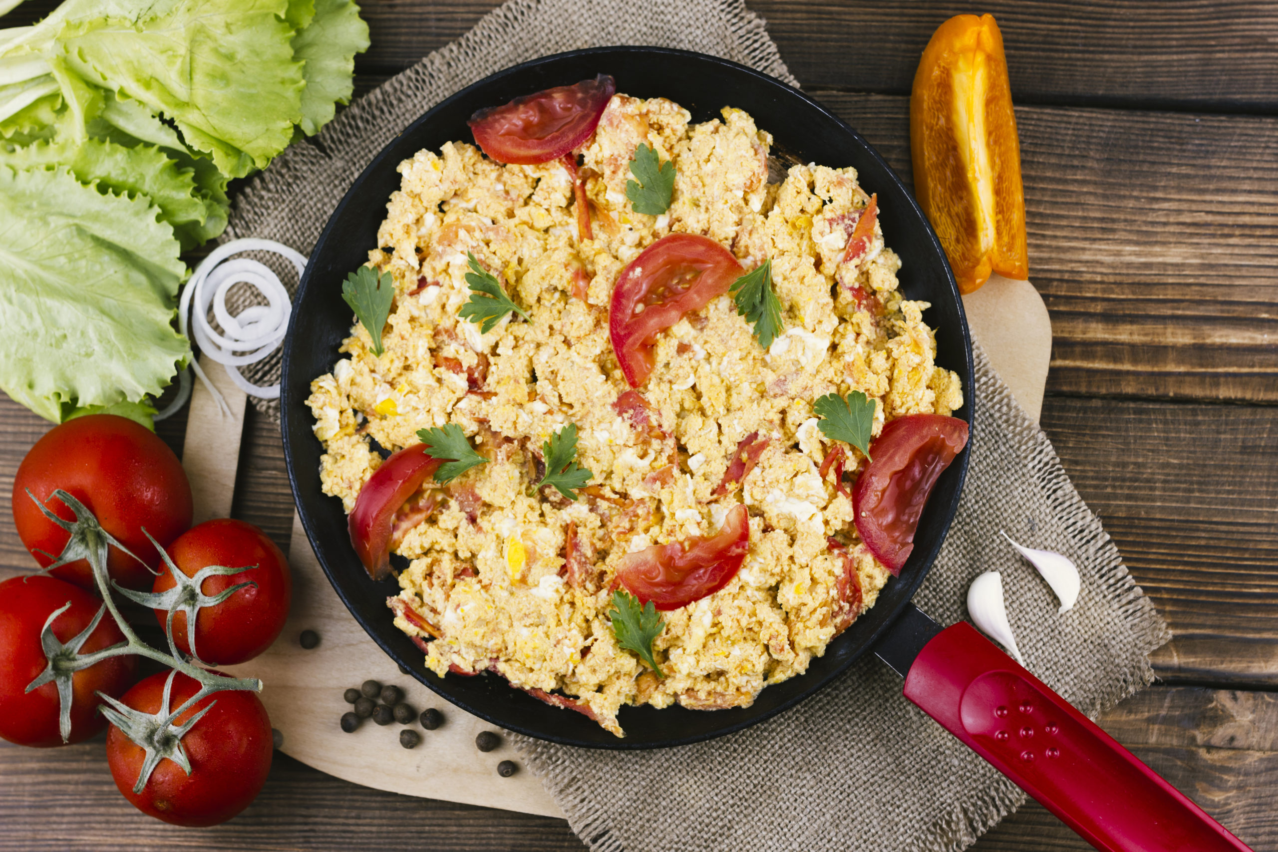 flat-lay-scrambled-eggs-with-tomatoes-recipe-scaled