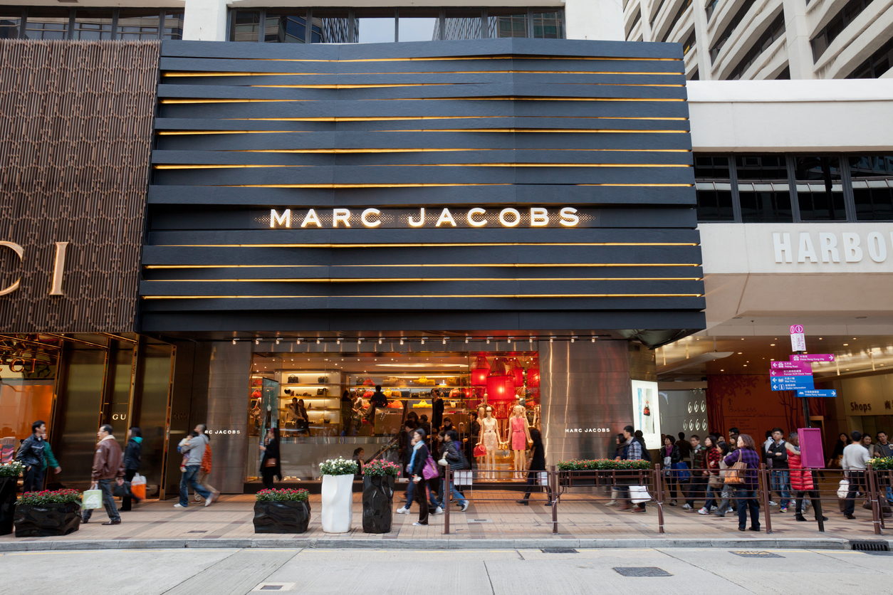 Pedestrians walk past Canton Road in Tsim Sha Tsui, Kowloon, Hong Kong. Many international famous fashion brand are located in Tsim Sha Tsui Shopping District. Marc Jacobs flagship store is located in this street.